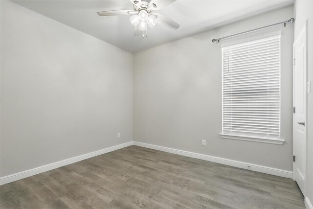 1708 Lapetus, Haslet, TX 76052 - empty room featuring a ceiling fan, wood finished floors, and baseboards