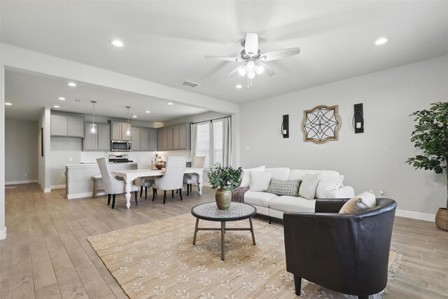 1708 Lapetus, Haslet, TX 76052 - living area featuring baseboards, a ceiling fan, light wood-style floors, and recessed lighting