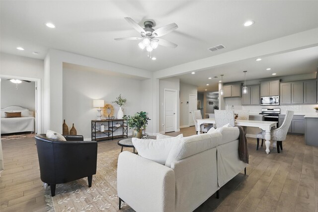 1708 Lapetus, Haslet, TX 76052 - living room with a ceiling fan, light wood finished floors, and recessed lighting