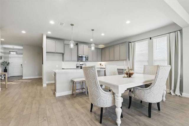 1708 Lapetus, Haslet, TX 76052 - dining room with baseboards, recessed lighting, and light wood-style flooring