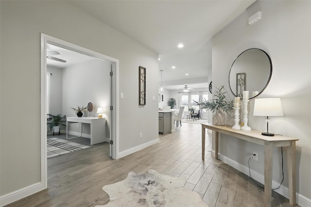 1708 Lapetus, Haslet, TX 76052 - hallway featuring light wood finished floors, recessed lighting, baseboards, and a desk