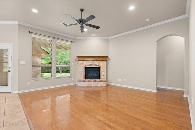 401 Shumard Oak Trl, Keller, TX 76248 - unfurnished living room with light wood-style flooring, a ceiling fan, a fireplace, recessed lighting, and ornamental molding