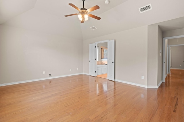 401 Shumard Oak Trl, Keller, TX 76248 - unfurnished bedroom with light wood-style floors, connected bathroom, high vaulted ceiling, and a ceiling fan