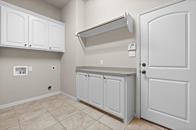 401 Shumard Oak Trl, Keller, TX 76248 - laundry room featuring electric dryer hookup, washer hookup, cabinet space, and light tile patterned flooring
