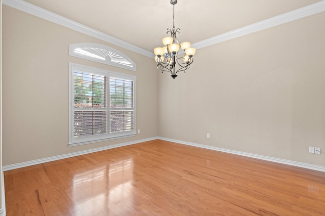 401 Shumard Oak Trl, Keller, TX 76248 - spare room featuring a chandelier, crown molding, and light wood-style flooring
