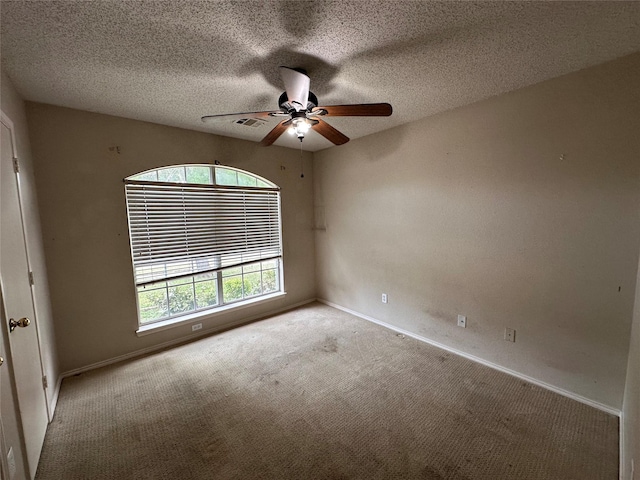 4102 Baccarat Dr, Garland, TX 75043 - carpeted spare room with a ceiling fan, baseboards, and a textured ceiling
