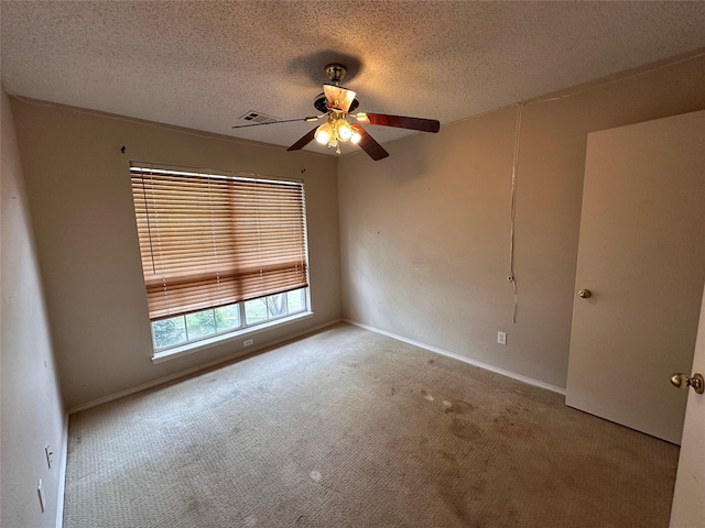 4102 Baccarat Dr, Garland, TX 75043 - unfurnished room featuring carpet floors, ceiling fan, a textured ceiling, and baseboards