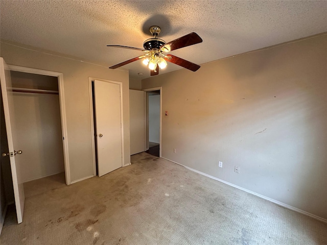 4102 Baccarat Dr, Garland, TX 75043 - unfurnished bedroom featuring multiple closets, carpet, a textured ceiling, baseboards, and ceiling fan