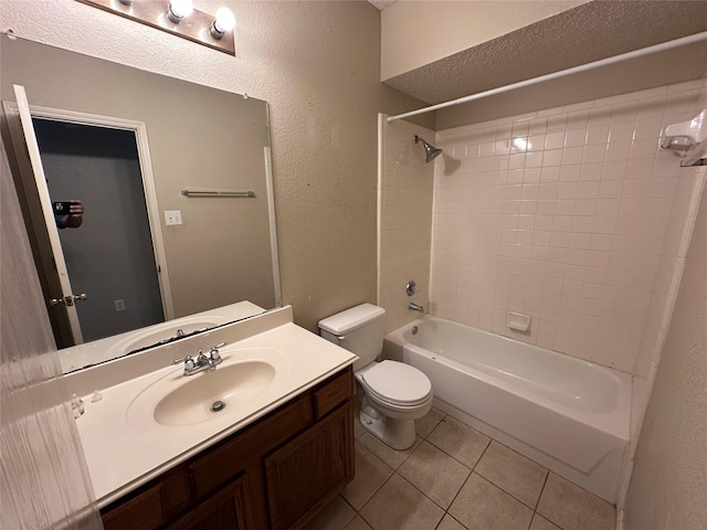 4102 Baccarat Dr, Garland, TX 75043 - full bath featuring toilet, shower / bathtub combination, tile patterned floors, vanity, and a textured wall