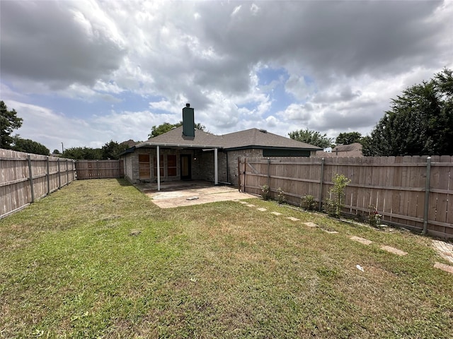 4102 Baccarat Dr, Garland, TX 75043 - back of property featuring a patio and a chimney