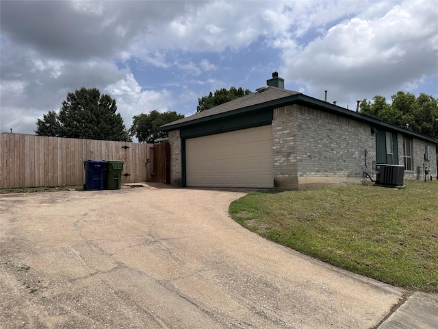 4102 Baccarat Dr, Garland, TX 75043 - view of property exterior with brick siding, concrete driveway, an attached garage, a chimney, and central AC unit