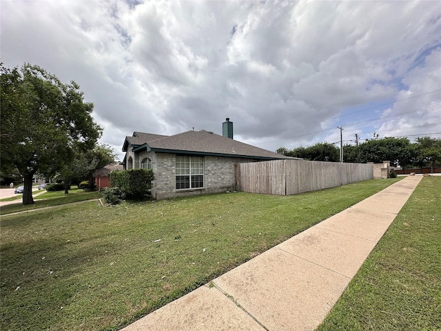 4102 Baccarat Dr, Garland, TX 75043 - view of side of home with a chimney
