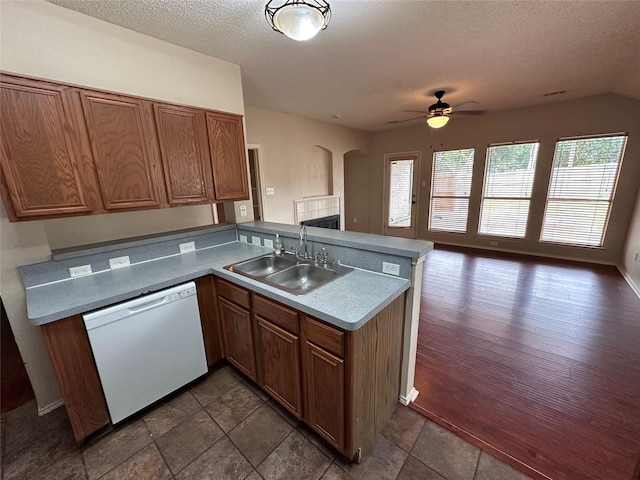 4102 Baccarat Dr, Garland, TX 75043 - kitchen featuring dishwasher, a sink, ceiling fan, a peninsula, and a textured ceiling