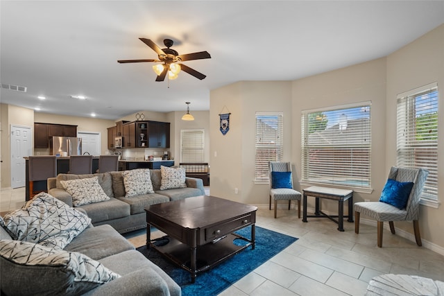 8208 Burleigh St, Frisco, TX 75035 - living area featuring ceiling fan, light tile patterned flooring, baseboards, and recessed lighting
