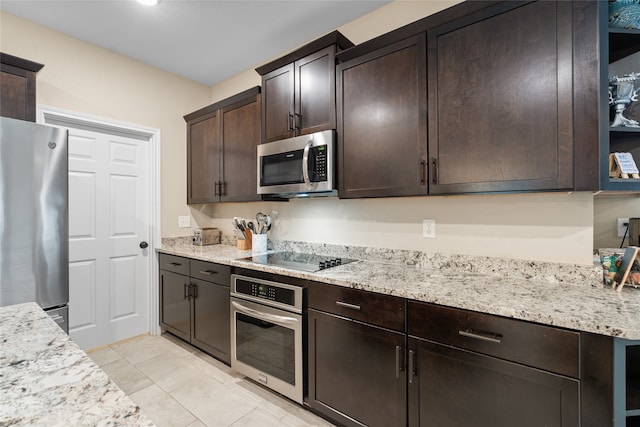 8208 Burleigh St, Frisco, TX 75035 - kitchen featuring appliances with stainless steel finishes, dark brown cabinetry, light tile patterned floors, and light stone countertops