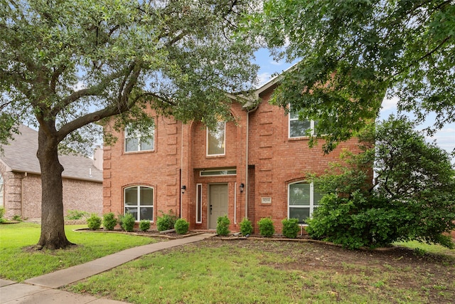 8208 Burleigh St, Frisco, TX 75035 - traditional home with a front yard and brick siding