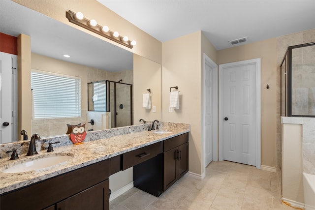8208 Burleigh St, Frisco, TX 75035 - full bathroom featuring double vanity, a shower stall, baseboards, tile patterned flooring, and a tub to relax in