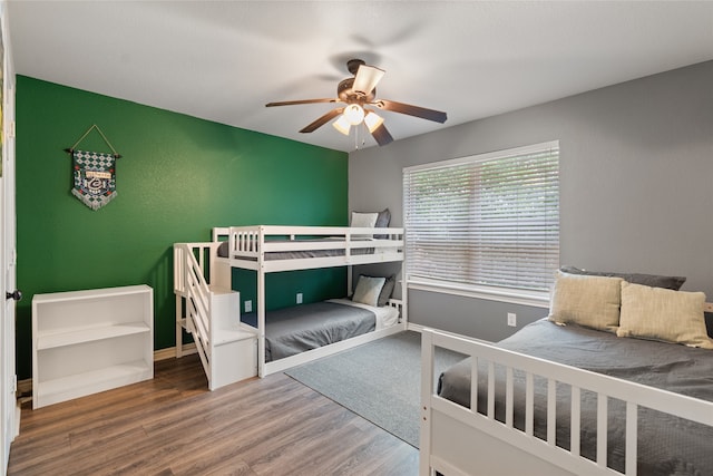 8208 Burleigh St, Frisco, TX 75035 - bedroom with wood finished floors and a ceiling fan
