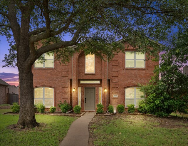 8208 Burleigh St, Frisco, TX 75035 - traditional-style house featuring a lawn and brick siding