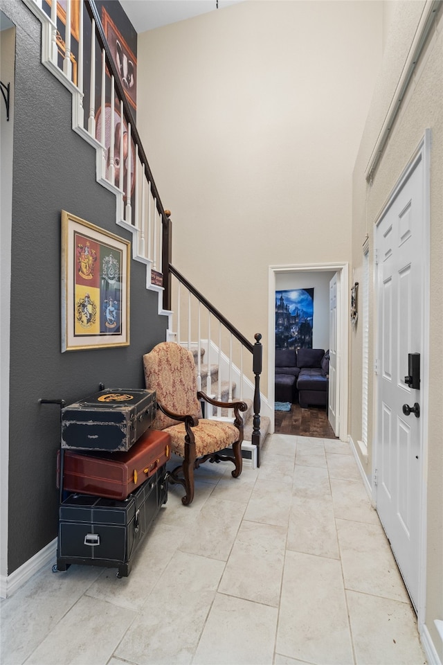 8208 Burleigh St, Frisco, TX 75035 - foyer entrance featuring stairs, tile patterned floors, baseboards, and a high ceiling
