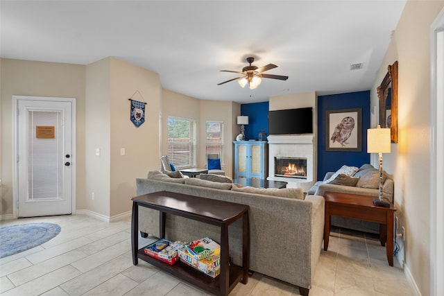 8208 Burleigh St, Frisco, TX 75035 - living room with ceiling fan, a brick fireplace, and baseboards