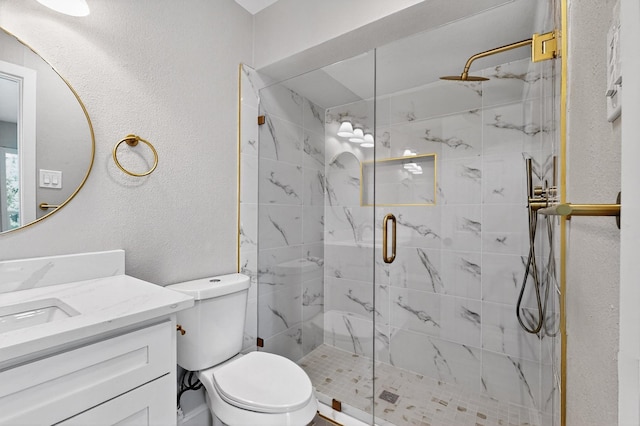 5919 E University Blvd Unit 238, Dallas, TX 75206 - full bath with vanity, a stall shower, toilet, and a textured wall