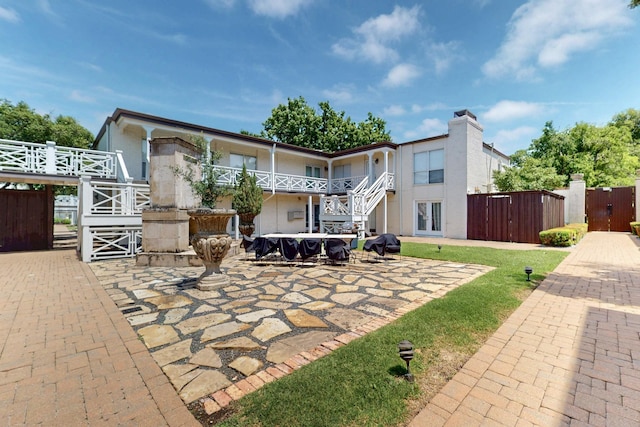 5919 E University Blvd Unit 238, Dallas, TX 75206 - back of house featuring stairs and a gate