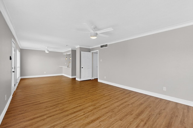 5919 E University Blvd Unit 238, Dallas, TX 75206 - empty room with crown molding, wood finished floors, baseboards, and ceiling fan
