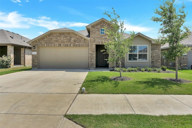16608 Portage St, Justin, TX 76247 - view of front facade featuring brick siding, a garage, concrete driveway, and a front yard