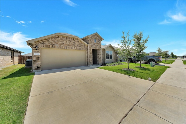 16608 Portage St, Justin, TX 76247 - view of front facade featuring driveway, central AC, brick siding, and a garage