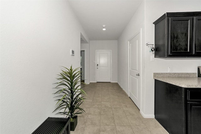 16608 Portage St, Justin, TX 76247 - hall featuring baseboards, recessed lighting, and light tile patterned floors