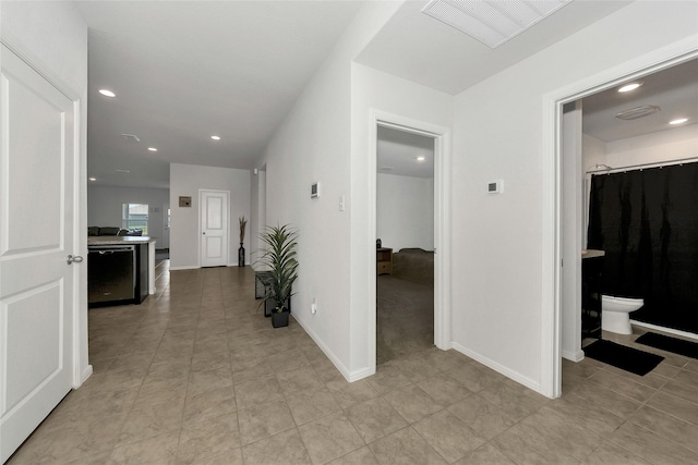 16608 Portage St, Justin, TX 76247 - corridor featuring recessed lighting, light tile patterned floors, and baseboards