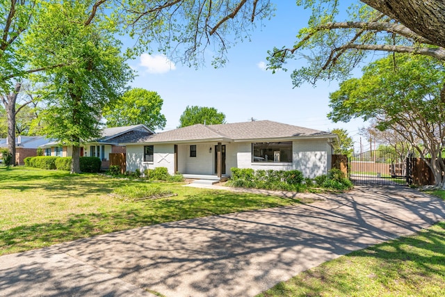 2305 Fenestra Dr, Dallas, TX 75228 - ranch-style home featuring a gate, brick siding, driveway, and a shingled roof