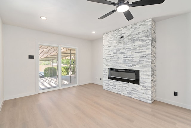 2305 Fenestra Dr, Dallas, TX 75228 - unfurnished living room featuring wood finished floors, a stone fireplace, ceiling fan, and recessed lighting
