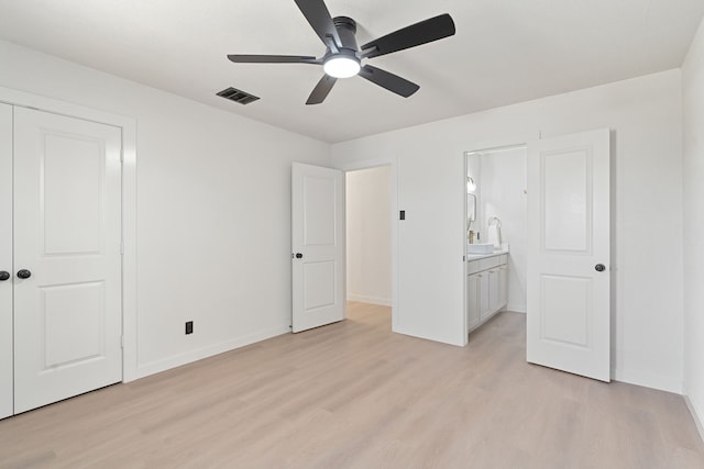 2305 Fenestra Dr, Dallas, TX 75228 - unfurnished bedroom with light wood finished floors, a closet, a ceiling fan, and ensuite bathroom