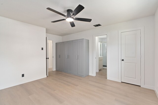 2305 Fenestra Dr, Dallas, TX 75228 - unfurnished bedroom with light wood-type flooring, connected bathroom, and a ceiling fan