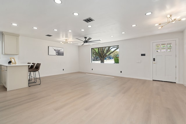 2305 Fenestra Dr, Dallas, TX 75228 - unfurnished living room with a chandelier, recessed lighting, and light wood-type flooring