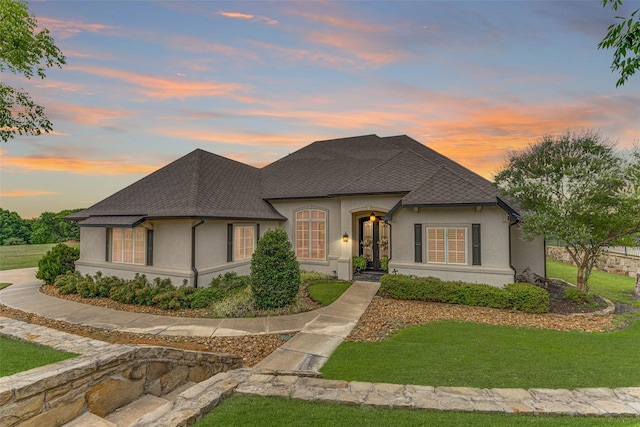 2412 Versailles Dr, Heath, TX 75032 - french country style house featuring stucco siding, a lawn, and a shingled roof