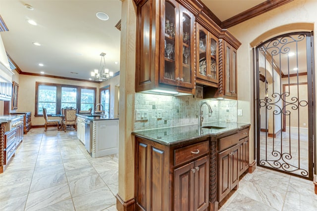 2412 Versailles Dr, Heath, TX 75032 - kitchen featuring crown molding, a sink, light marble finish flooring, glass insert cabinets, and decorative backsplash