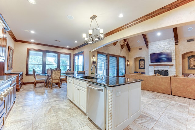 2412 Versailles Dr, Heath, TX 75032 - kitchen featuring stainless steel dishwasher, a sink, dark countertops, a chandelier, and a kitchen island with sink