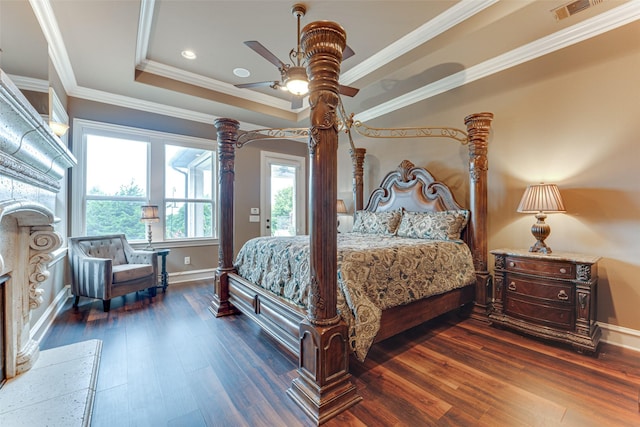 2412 Versailles Dr, Heath, TX 75032 - bedroom with baseboards, wood finished floors, a raised ceiling, ornamental molding, and a ceiling fan