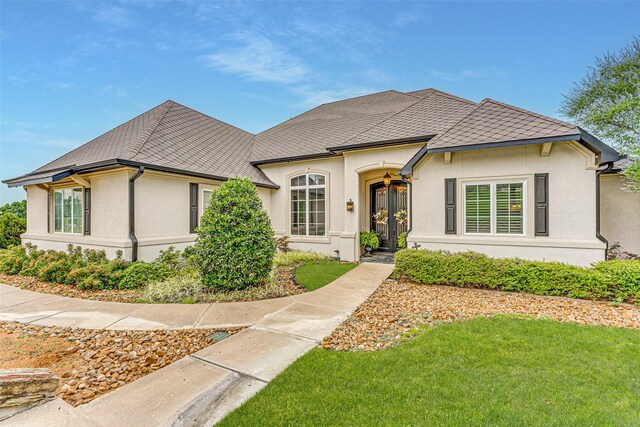 2412 Versailles Dr, Heath, TX 75032 - french country inspired facade featuring stucco siding and a front lawn