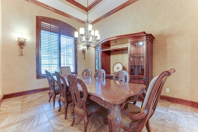 2412 Versailles Dr, Heath, TX 75032 - dining room with a chandelier, ornamental molding, and baseboards
