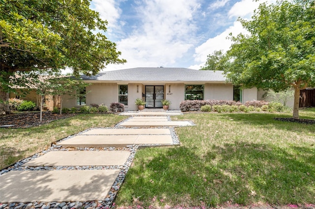 4047 Calculus Dr, Dallas, TX 75244 - ranch-style house with stucco siding, a front lawn, and french doors