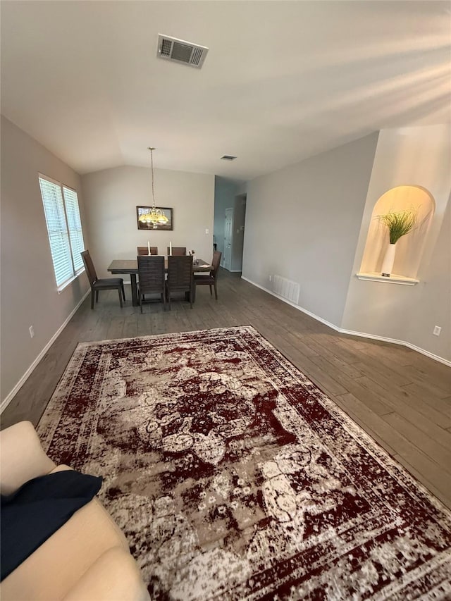 12804 Council Bluff Dr, Austin, TX 78727 - dining space featuring vaulted ceiling, hardwood / wood-style flooring, and a chandelier