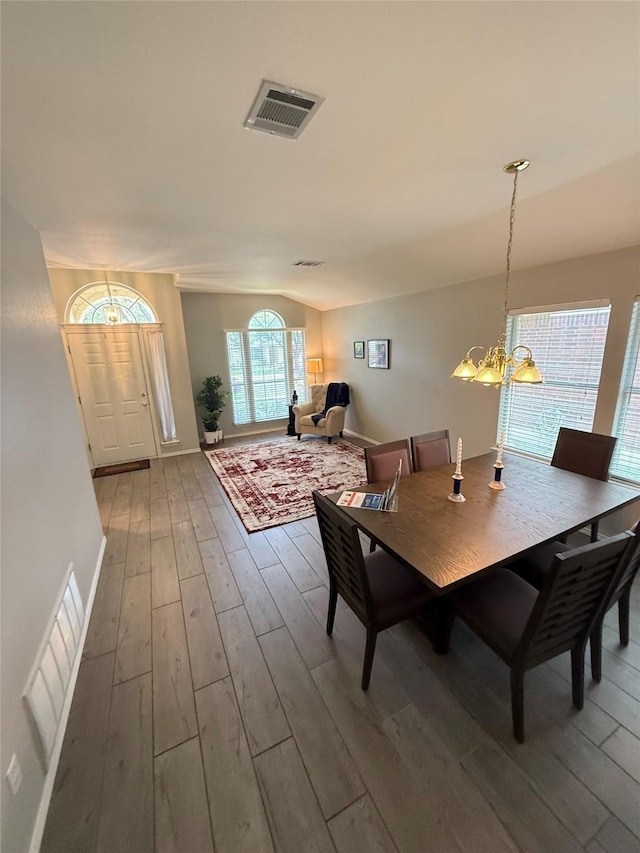 12804 Council Bluff Dr, Austin, TX 78727 - dining space featuring wood finished floors and a chandelier
