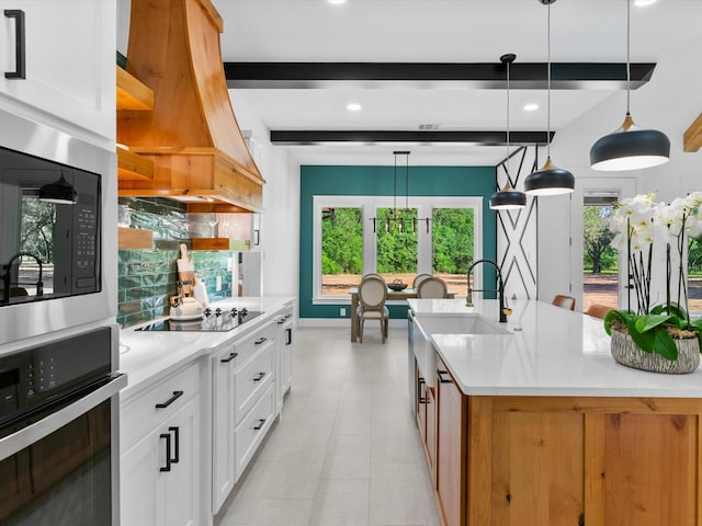 1705 J E, Woody, Springtown, TX 76082 - kitchen featuring wall oven, a sink, black electric stovetop, beamed ceiling, and light countertops