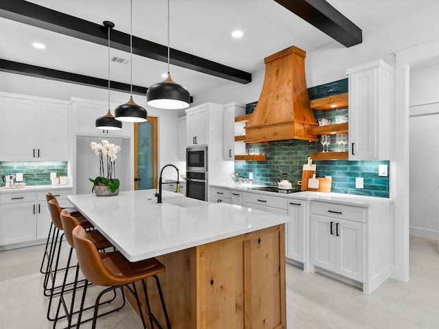 1705 J E, Woody, Springtown, TX 76082 - kitchen with a sink, custom range hood, beam ceiling, decorative backsplash, and light countertops