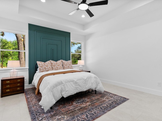 1705 J E, Woody, Springtown, TX 76082 - bedroom featuring a tray ceiling, multiple windows, baseboards, recessed lighting, and ceiling fan