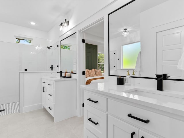 1705 J E, Woody, Springtown, TX 76082 - full bath featuring two vanities, a walk in shower, and plenty of natural light